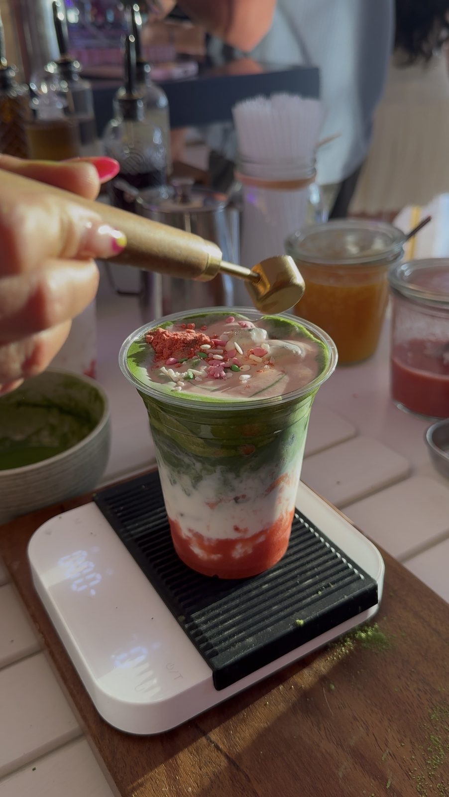 An ACEMATCHA barista preparing drinks during service