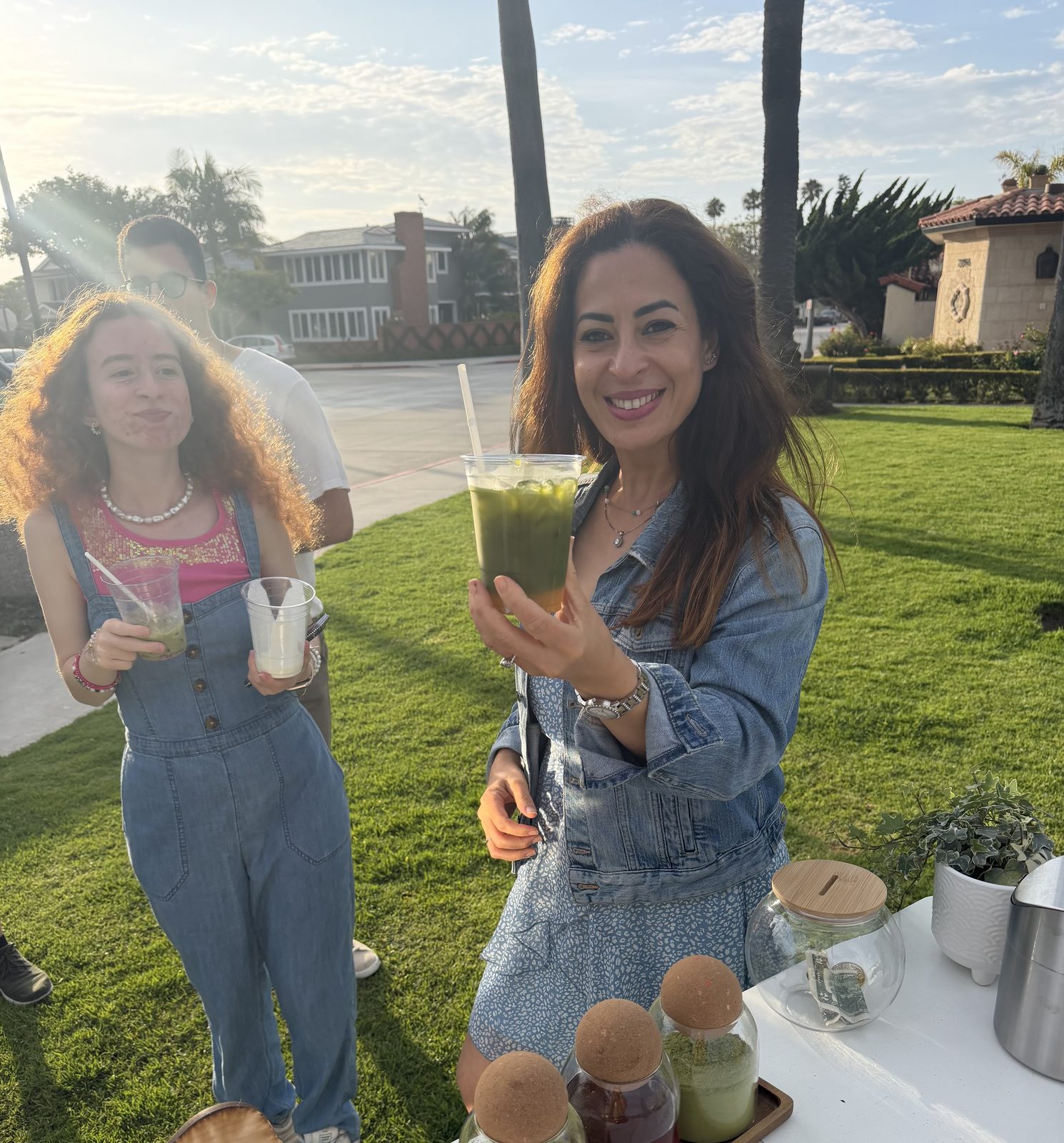 A guest picking up a fresh matcha at the cart